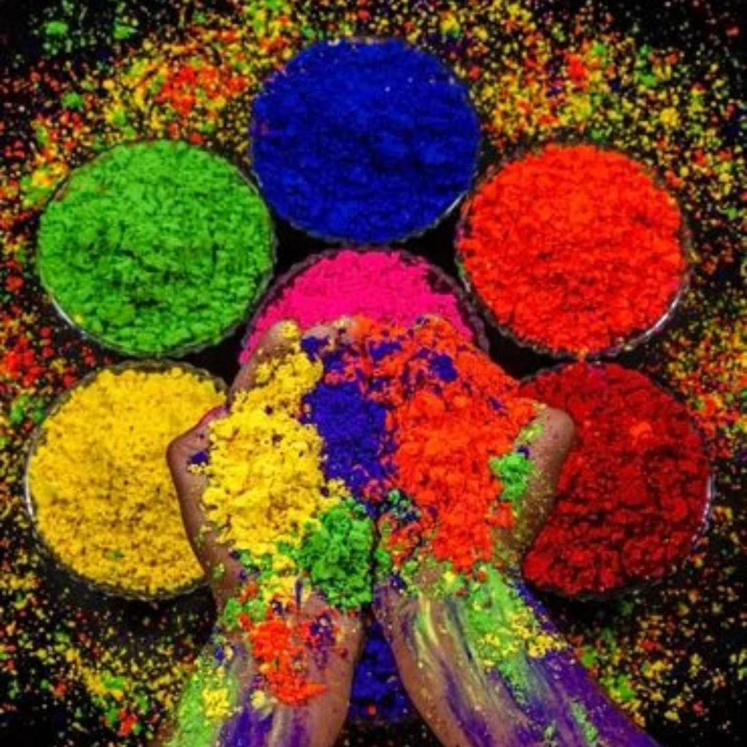 Bright Holi color powders in blue, green, yellow, pink and red
