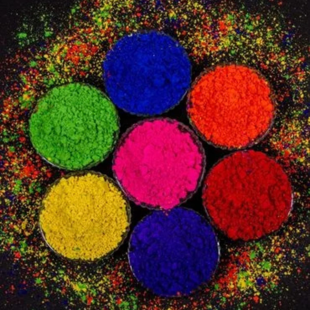 Multicolor Holi powder arranged in circular patterns